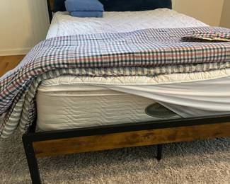 Full size mid-century inspired black iron and wood bed frame, mattress, linens