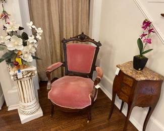 Velvet arm chair, French marble top table, column and silk flowers
