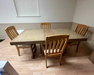 Dining table with 2 leaves and 4 chairs (sold separately)