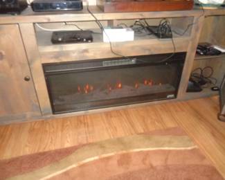Very nice entertainment center w/fire place w/remote
