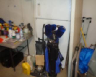 Kirby, golf clubs and fridge