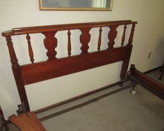 Full size bed that has been converted to Queen- frames/rails are there for both sizes