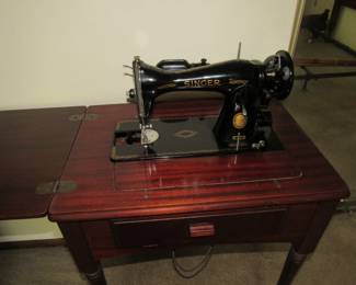 Singer 15-91 sewing machine in cabinet. Manufactured in 1955