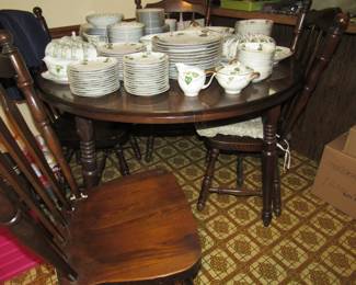 Kitchen table with four chairs- also has two additional leaves
