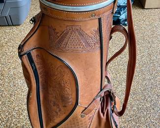 Vintage leather tooled golf bag with Aztec designs.