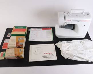Lot 7175 Singer Sewing Machine with Accessories and Attachments