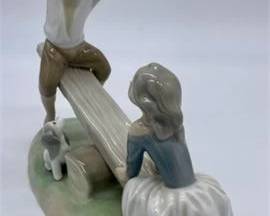 Lot 017   4 Bid(s)
Lladro #4867 Boy Girl Seesaw Figurine'