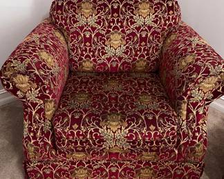Red upholstered armchair