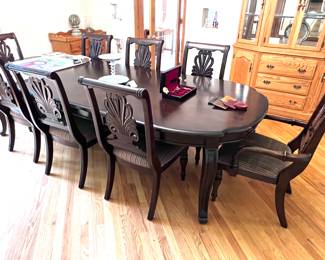 Dining room table with pull out leaves and 8 chairs.