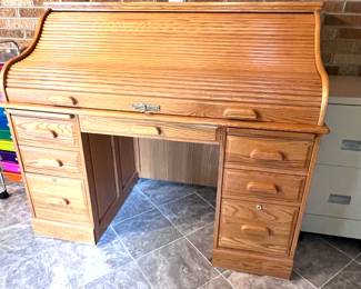 Solid oak rolltop desk with many small cubbies and drawers inside.  Classic Oak Purchase.  Excellent condition.
