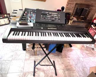 Casio keyboard on stand. Cord missing. 