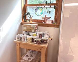 Campbell Soup soup mugs (5). Old cigar boxes (empty). Windchimes and Madeleine on a bench figurine. 