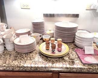 Stoneware, egg cups, miscellaneous condiment jars. 