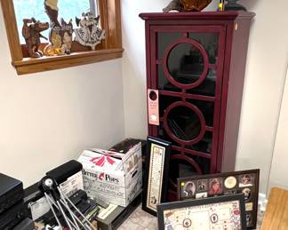 Tall cabinet, picture frames, beef jerky dryer, tall cabinet, vintage mirror, clock on slice of tree. 