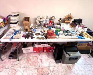 Sentry safe (no key), children's VHS tapes from Casper to Fantasia. Procelain faced dolls, wooden lattice clock. 