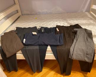 Men's dress pants. Many with tags still attached. In excellent condition. Sizes range from 32-34W x 29-30L. Some larger. 