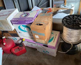 Cat-5 wire and fabric strapping. Several plastic gas cans. 