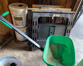 Seed spreader, two 5-gallon buckets of mineral spirits, four folding workhorses.  