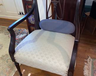 Dark wood chair with cream seat