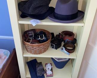 Sturdy shelf with men’s accessories including Stetson hat
