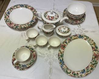 Doulton Fine China.  4 plates, 1 platter, 1 tea pot, 1 creamer, 1 sugar bowl, 4 cups, 3 soup bowls, 4 salad plates.