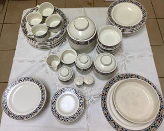 Mikasa Intaglia Dinnerware. 1 platter, 8 plates, 8 soup bowls, salt and pepper shaker, 1 salad server, 8 salad plates, 1 sugar bowl, 1 creamer, 8 bread plates, 4 fruit bowls, 4 cups.