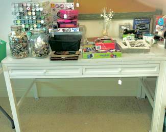 Great looking work table with many sewing craft items
