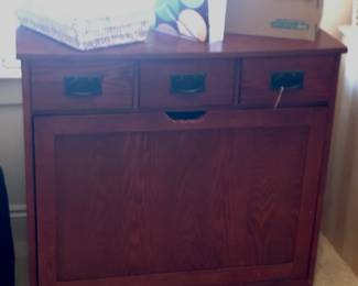 It's deceptive but it's a laundry hamper - looks as if you could change clothes in your office and no one would know...