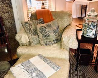 Overstuffed chair with ottoman and all that's needed on a cold day (except the fire and the butler)