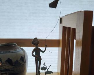 Bronze boy with kite sculpture