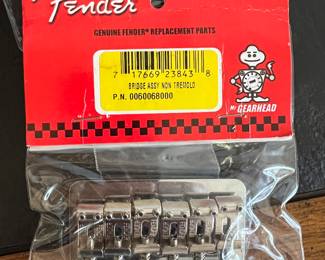 Hundreds of pieced of NIB Fender guitar accessories