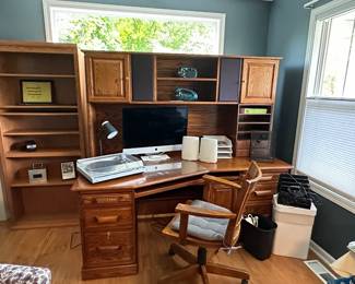 Office furniture including desk and shelving units.