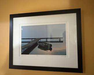 Signed wall hanging of a boat and dock on Higgins Lake