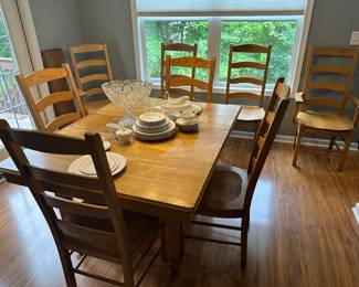 Dining room table and 8 chairs, 5 leaves