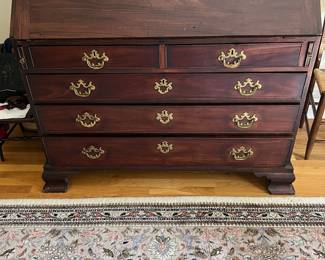 English 18th C. Mahogany slant front desk with fitted interior. Original bracket feet with great patina in two over three-drawer configuration + outside dovetailing.  Spectacular piece for its age.  Looks fabulous in person.