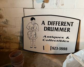A different drummer antique sign 