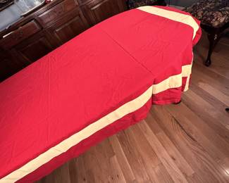 Custom sewn deep red tablecloth with thick butter yellow border 7'10" x 5'2"