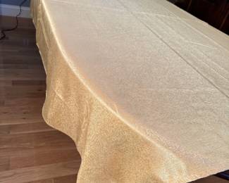 Luxurious gold tablecloth, minor wear and a few pulls, 7' x 5'