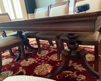 #2 Rectangular Dark Wood Cherry Table w/double Pedistal Legs w/8 chairs (2 captains Chairs) 66-81x44x30 (has table pads) $375.00