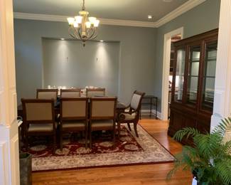 #2 Rectangular Dark Wood Cherry Table w/double Pedestal Legs w/8 chairs (2 captains Chairs) 66-81x44x30 (has table pads) $375.00
#3 Machine Made Burgundy/Cream Floral Motif- Nourison Brand 8'6" x 11'6" - Wool from New Zealand $400.00
#4 Bassett China Cabinet - 2 pc. w/3 drawers, 3 wood doors & 2 glass Doors - w/beveled Glass Doors & Lighted - 65x18x30-84 $325.00