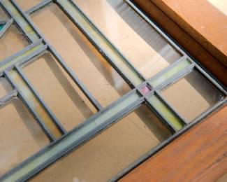 Corner and frame detail of the glass of Arts & Crafts, Prairie School, stained glass window