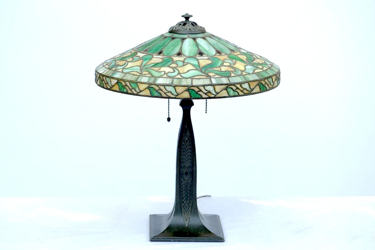 Spectacular antique art nouveau bronzetable lamp with leaded glass shade