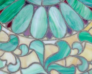 Another top detail of the glass on antique art nouveau bronze table lamp with leaded glass shade