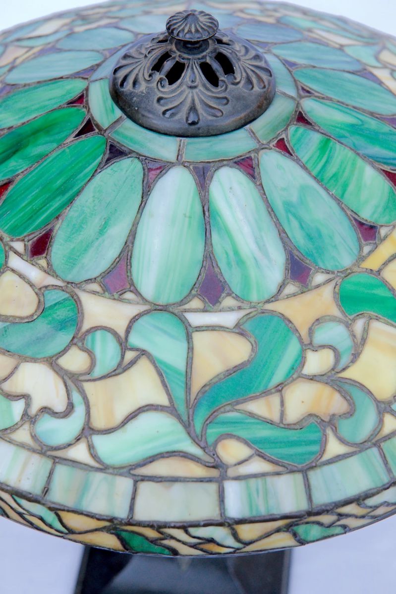 Another top detail of the glass on antique art nouveau bronze table lamp with leaded glass shade