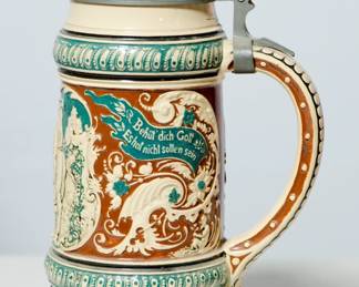 Handle right view of vintage ceramic beer stein with pewter lid (#7), inscription reads "Behut dich Gott Es hat nicht sollen sein"