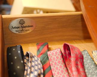 Drawer detail "Antique Adaptations by Davis Cabinet Company, Nashville, Tennessee" of bowfront four-drawer chest of drawers