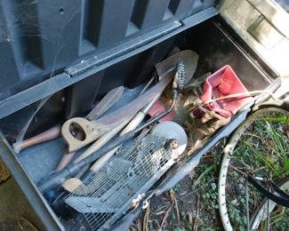 Outdoor plastic storage container of outdoor tools including saws and squirrel trap