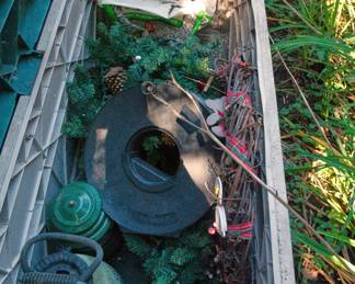 Outdoor storage container full of yard decorations