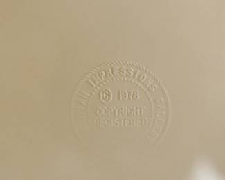 Embossed stamp detail of "Fire Dancer" editioned serigraph print, 289/800, 1978, reads, "... Impressions Gallery, copyright 1978"