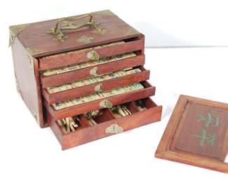 3/4 view of STUNNING antique Mahjong set in wooden 5-drawer box with each drawer open to reveal mahjong pieces. Front panel set to the side.
